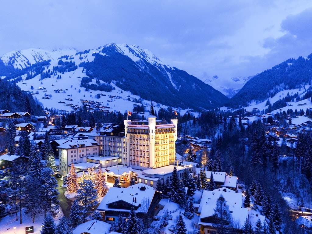 Gstaad Palace hotel in the Swiss Alps, snow-covered surroundings